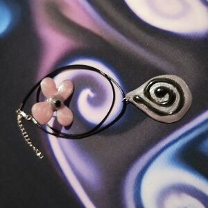 Elegant Purple and Black Swirl Pendant Necklace And Pink Ring Set.